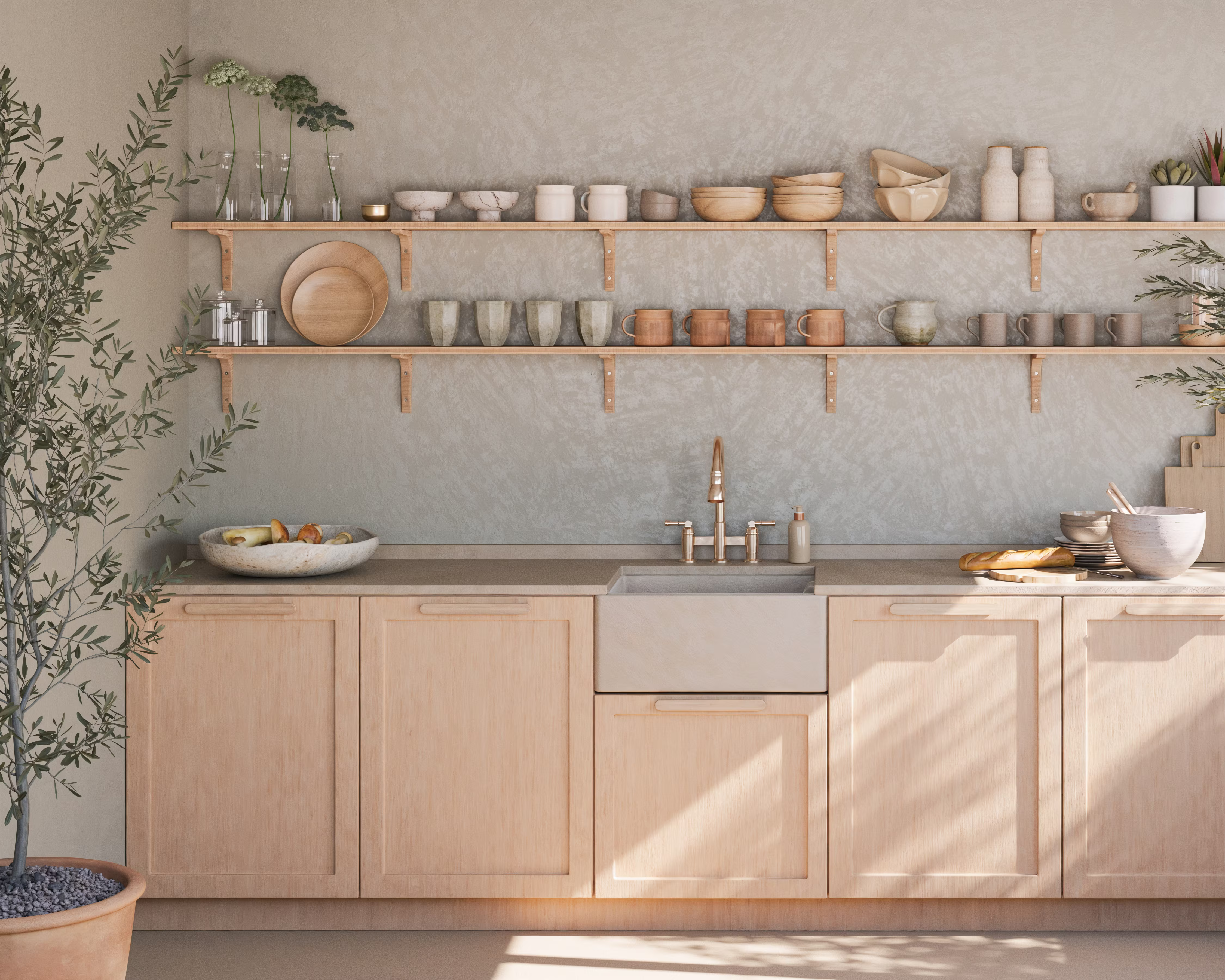 A minimalist, sunlit kitchen with light wood cabinetry, open shelving, and neutral-toned ceramics. Natural textures and earthy tones create a warm, organic feel, complemented by greenery and soft, diffused light.